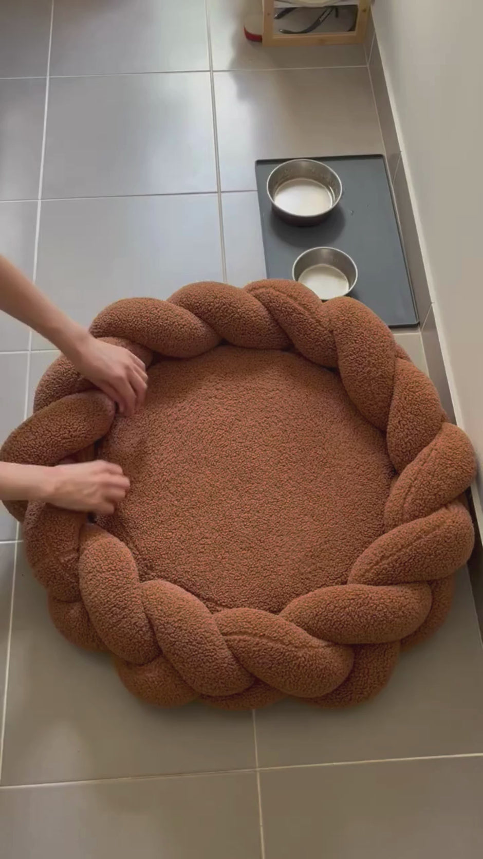 Removable machine washable cover being taken off The Hersh Bed chestnut Teddy dog bed