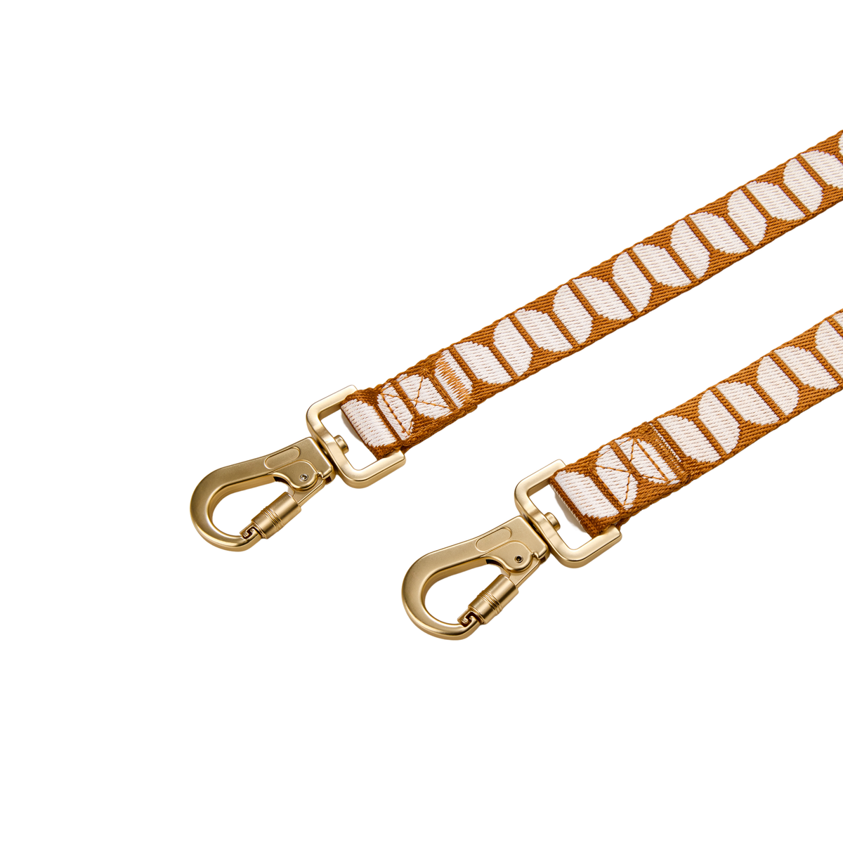 The Hersh Bed Animal designer dog leash with patterned webbing and gold hardware on a white background
