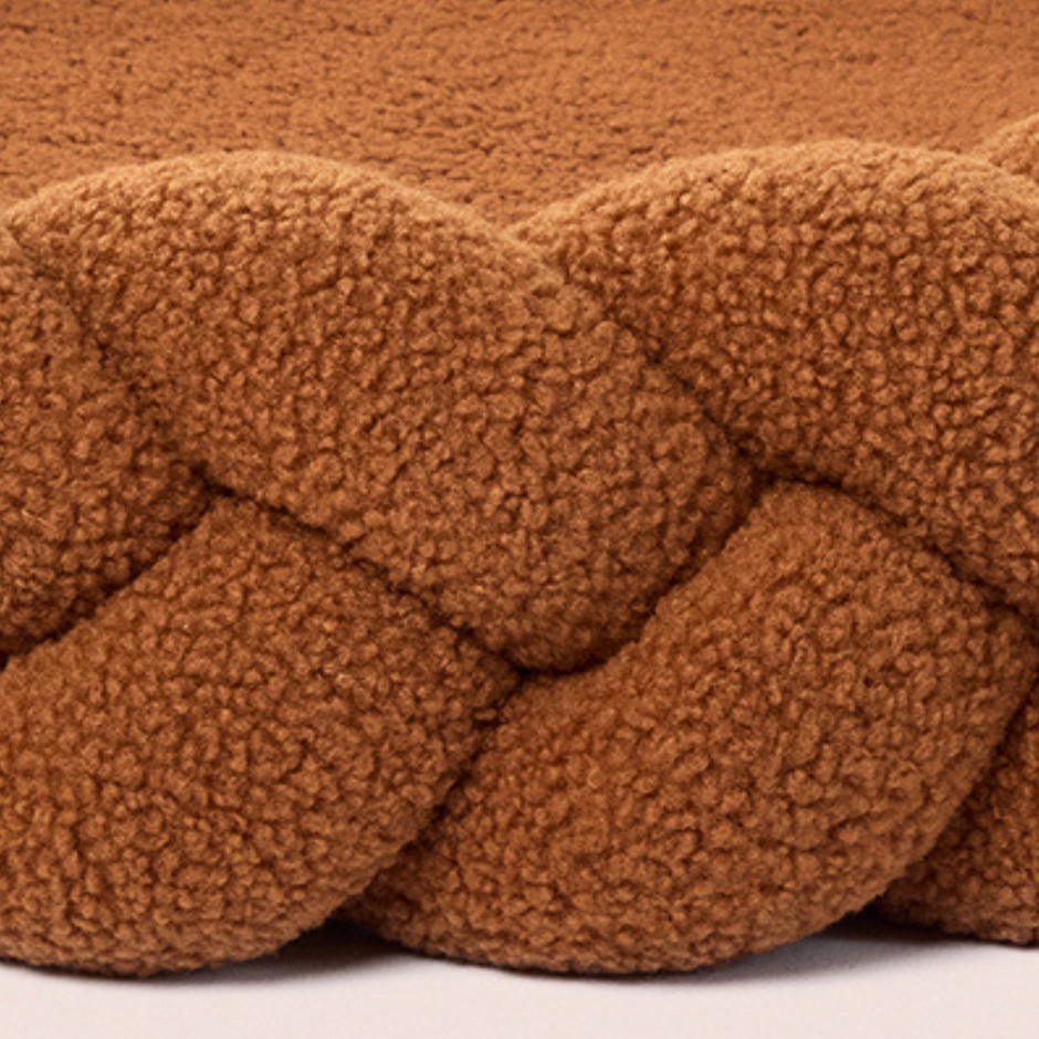 Close-up of soft chestnut Teddy fabric and braided design on The Hersh Bed dog bed